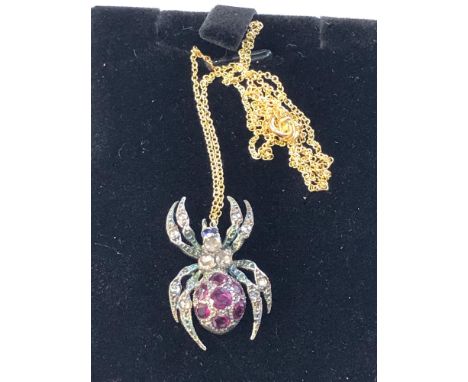 Rose diamond and ruby spider pendant and chain gold back silver front with 18ct gold chain body set with rubies and rose diam