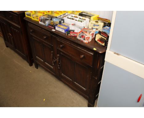 An oak Ercol sideboard