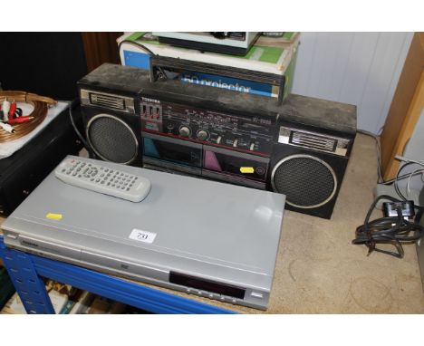 A Toshiba DVD player with remote control, a Toshiba radio cassette recorder