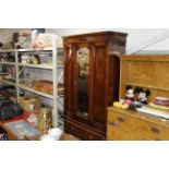 An oak mirror door wardrobe