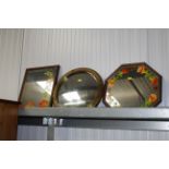 A circular convex mirror and two other mirrors
