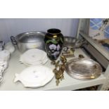 A collection of silver plated ware, two candle sco