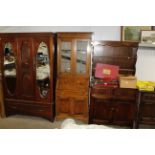 An oak and leaded glazed bureau bookcase