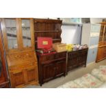An oak linen fold decorated dresser