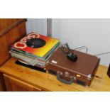 A Bush record player and a collection of records