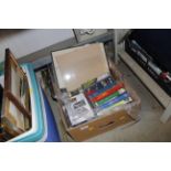 A box of DVDs, videos and books etc.