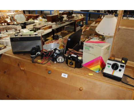 A vintage Roberts radio and a polaroid camera etc