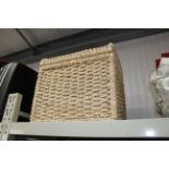 A wicker laundry basket