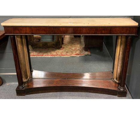 An Empire mahogany and parcel gilt rectangular console table, with white marble top, mirrored backing and side columns on a c