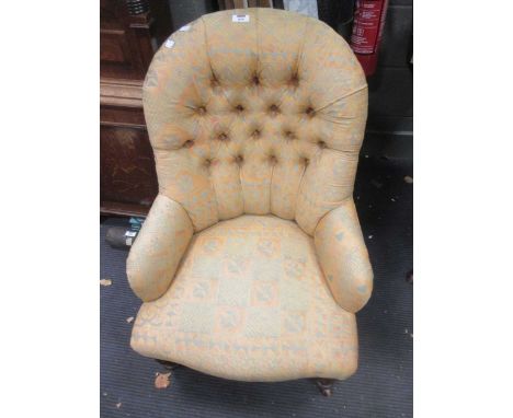 A Victorian button back nursing chair on turned legs and casters, and a carved wood long stool, upholstered seat