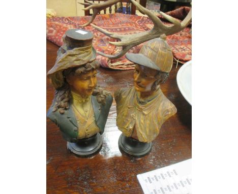 A pair of Continental pottery busts of two riders in the manner of Goldscheider, marked 'BB3427', 36cm high