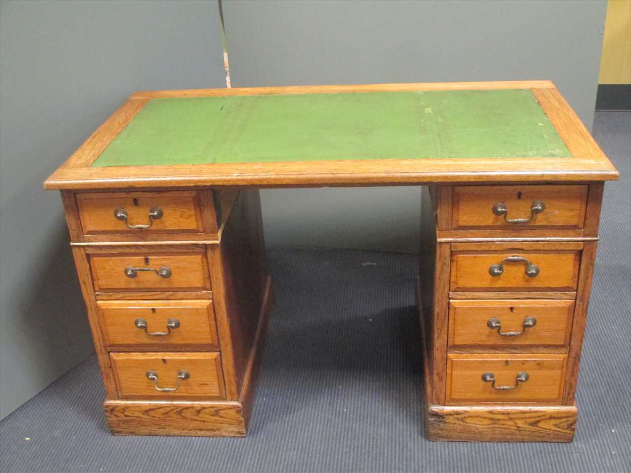 An oak leather topped desk, 75 x 121 x 66cm in Cheffins Fine Art