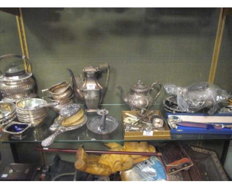 A collection of silver plated ware including flatware, a chamber stick, tea and coffee pots, kettle and stand etc together wi