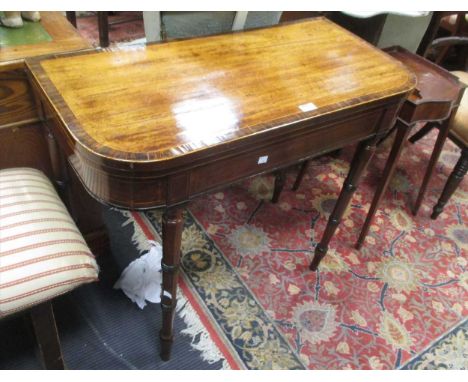 A Regency mahogany and rosewood cross banded card table, on ring turned tapering legs (a/f), 75 x 91 x 45cm