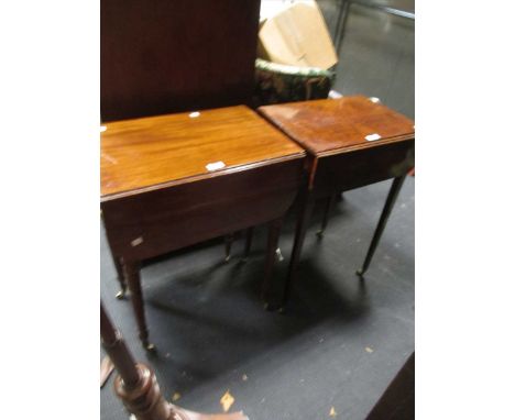 A late Regency mahogany small Pembroke table, with twin apron drawers, on ring turned legs capped with brass castors, and a R