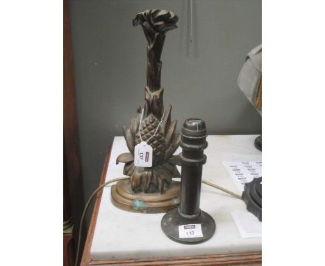 A late Victorian brass fruiting 'pine-apple' base door stop, and a trench-art candlestick (2)