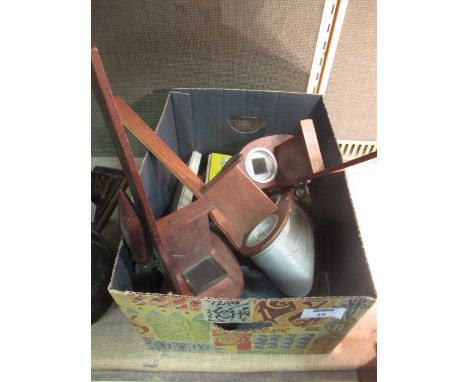 Three handheld stereoscope viewers with various viewing cards and glass plates