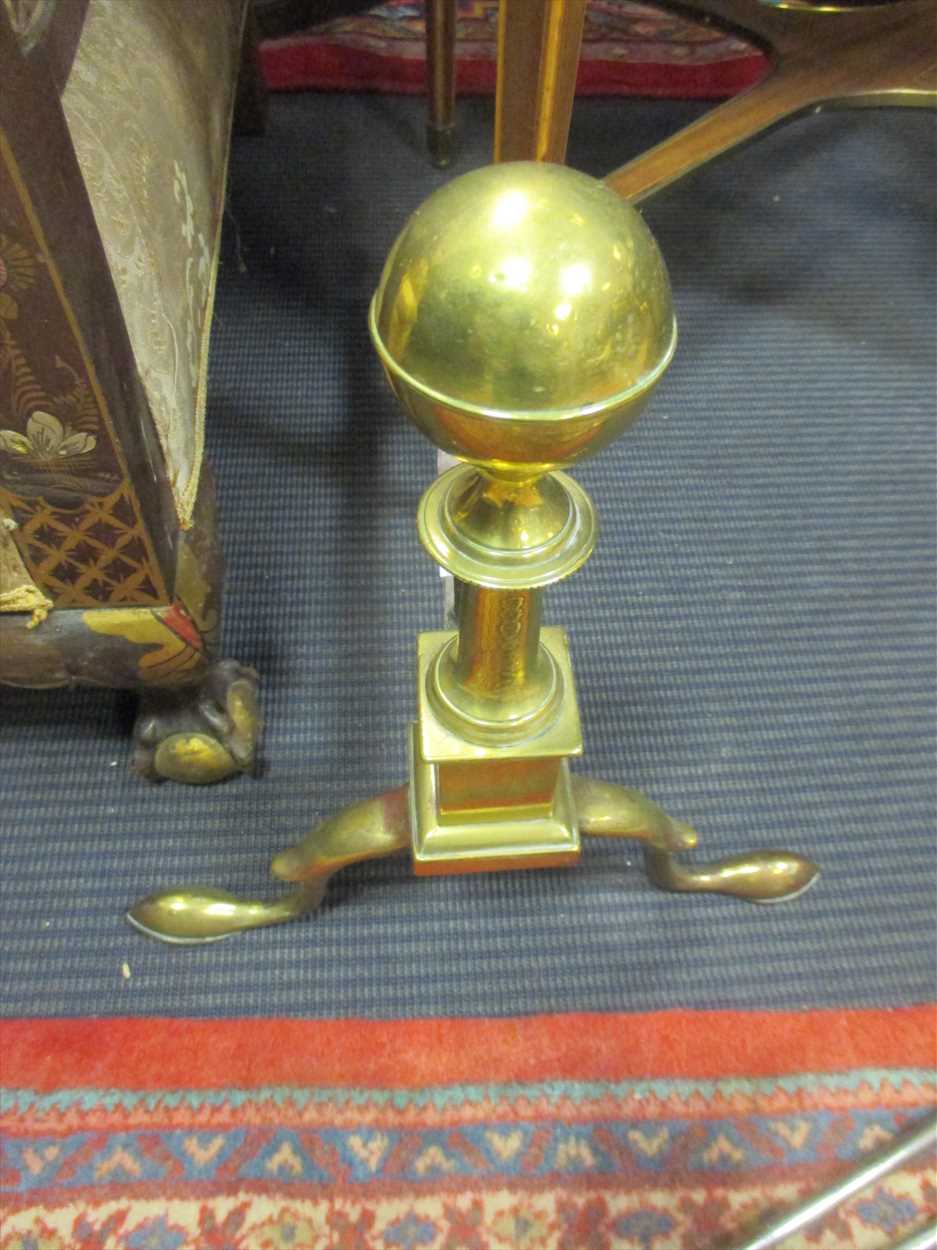 A pair of brass fire ball of turned ball finial form together with a ...