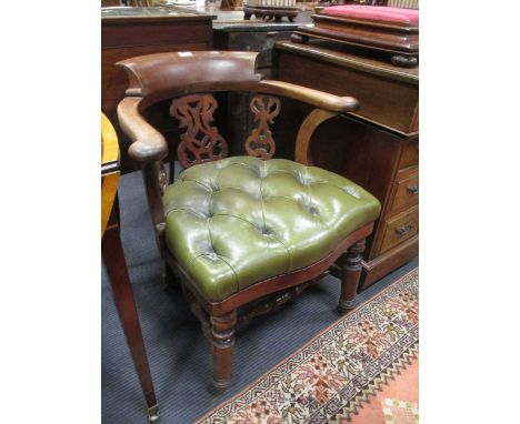 A Victorian mahogany smokers bow armchair with green button leather seat