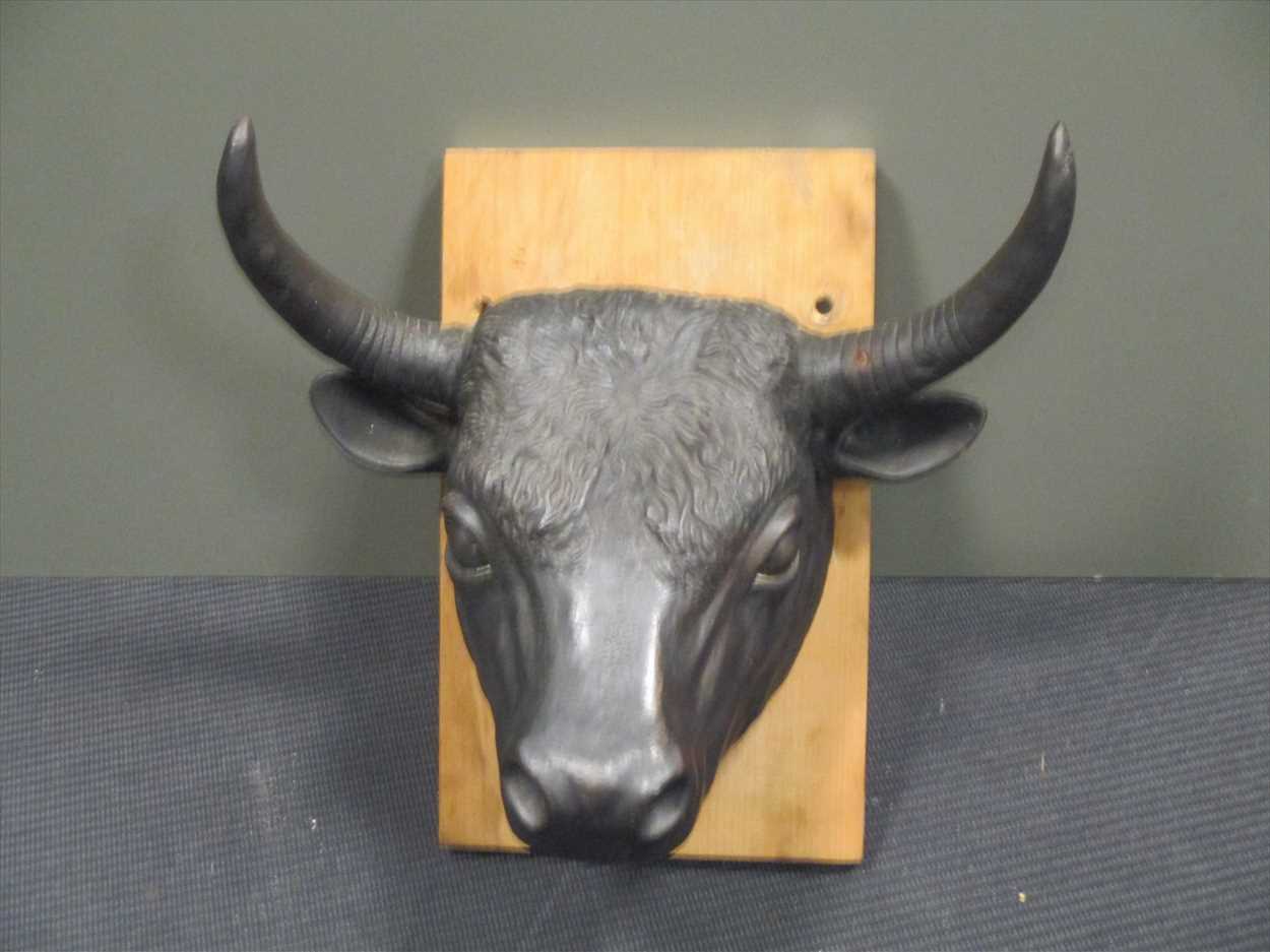 A cast iron bull's head in Cheffins Fine Art