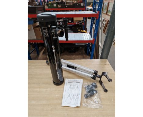 A SkyWatcher telesope with tripod, lenses and manual.