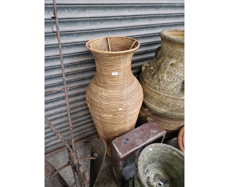 An very large Indonesian Rattan vase and a brown Belfast sink. 