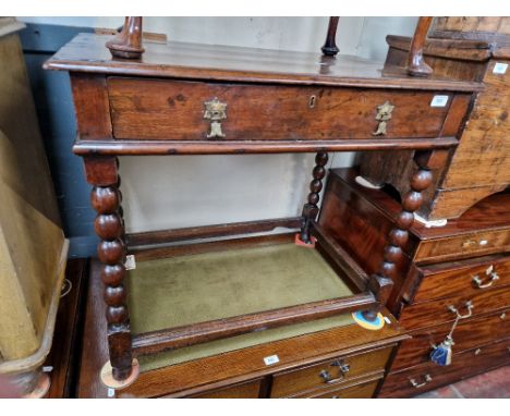 An 18th century oak side table with bobbin turned supports. Dimensions- height 71.5cm, width 84cm and depth 50cm.Condition- s