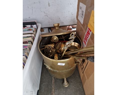 A brass coal bucket, brass fire irons, miniature miner's lamp, trivets, etc. 