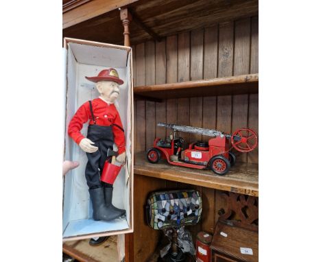 An Elder Folk fireman doll together with a scratch built model fire engine. 
