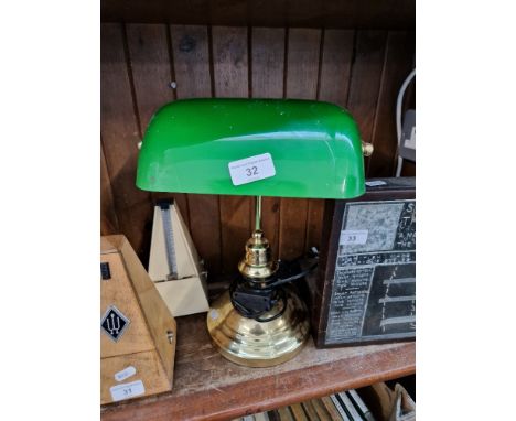 A vintage metal and green glass desk lamp. 