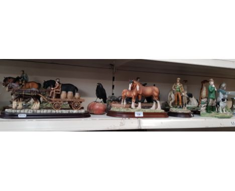 A group of figurines mainly modelled as working horses, dogs, shepherds, and farm vehicles, mostly from the Leonardo and Juli