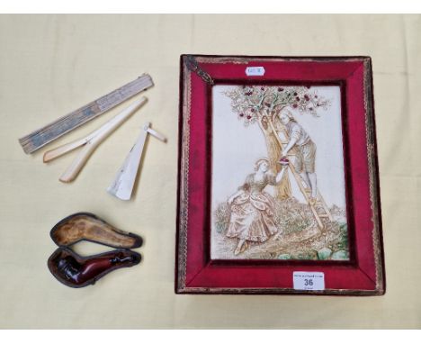 A vintage chocolate box together with a ladies leg pipe and plastic glove stretchers, and two fans. 