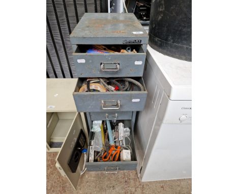 A set of Bisley metal filing drawers containing various tools, etc. 