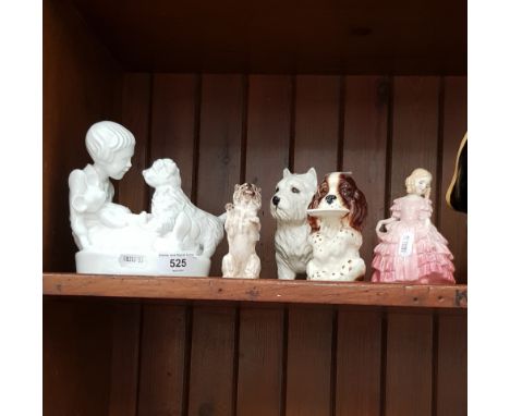 A group of porcelain ornaments including two Beswick dogs, a Royal Doulton dog and a Royal Doulotn figure, and a Spode figure