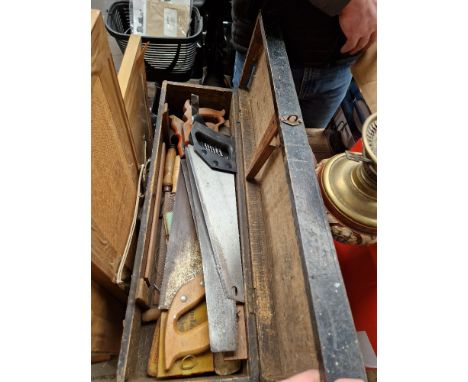 A toolbox with various tools, mainly woodworking, chisels, saws, etc. 