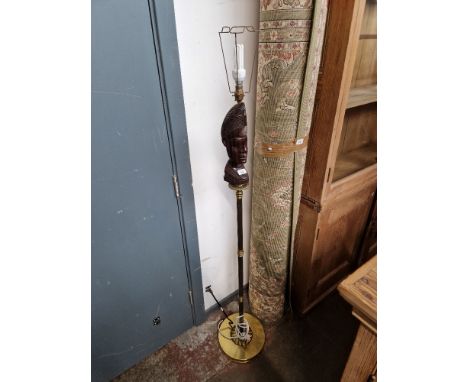 A vintage brass and carved wood standard lamp. 