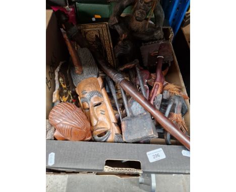 A box of assorted treen including African, walking stick, masks etc. 
