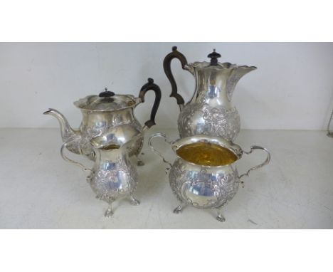 A silver hallmarked coffee and tea service consisting of teapot, milk jug, sugar bowl and coffee pot - all marked for James W