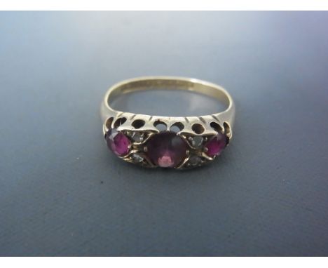 An 18ct yellow gold ruby and diamond ring size L - approx weight 4 grams - ring has deformation to bottom