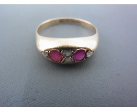 An 18ct yellow gold ruby and diamond ring size M - approx weight 2.9 grams - good condition