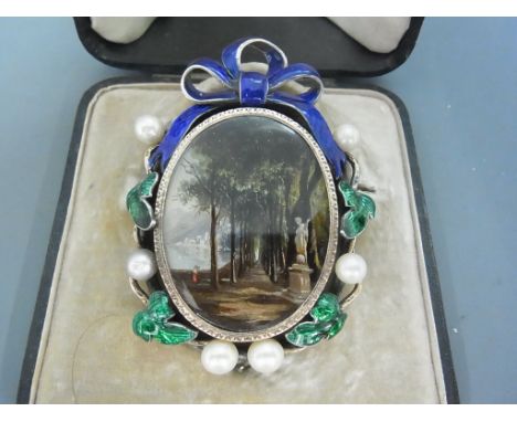 A Victorian silver, enamel, cultured pearl and miniature memorial brooch - The painted panel, depicting a tree lined avenue w