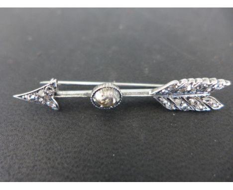 A Victorian white metal rose-cut diamond arrow brooch- Length 5.7cms - some usage marks