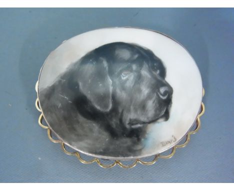 A 9ct yellow gold surround brooch with a hand painted portrait of a black Labrador on ceramic oval signed Binks - good condit