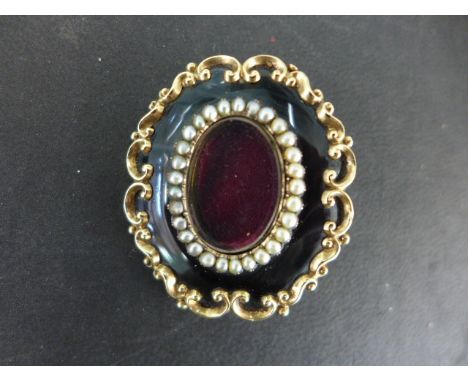 A Victorian 15ct enamel and seed pearl memorial brooch - 4.5x3.8cms - engraved to back Mary Harris died 10th June 1849, aged 