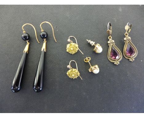 A pair of 9ct yellow gold earrings set with pearl and small clear stone, a pair of drop earrings set with amethysts, a pair o
