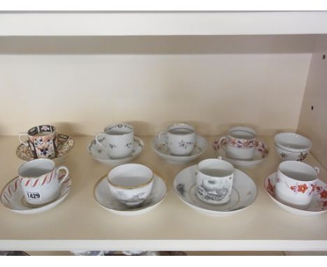 A collection of 18th and 19th century cups, saucers and coffee cans and saucers - eleven in total including Worcester and Der