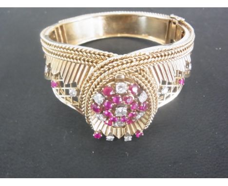 A Rolex 18ct gold diamond and ruby ladies cocktail watch, circa 1960, in the form of a tiara, set with thirteen diamonds, 0.1