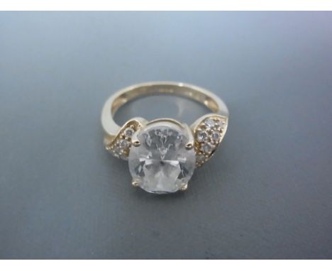 A 14ct yellow gold dress ring set with cubic zirconia to shoulder - ring size K - approx weight 1.8 grams - clean and bright