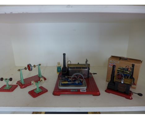 A Mamod steam engine SPI with box and a Mamod stationary engine with three work shop pieces - all show signs of use
