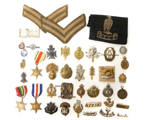 Collection of cap badges, WWII medals and other uniform appointments Collection of eighteen British Army cap badges, also ten